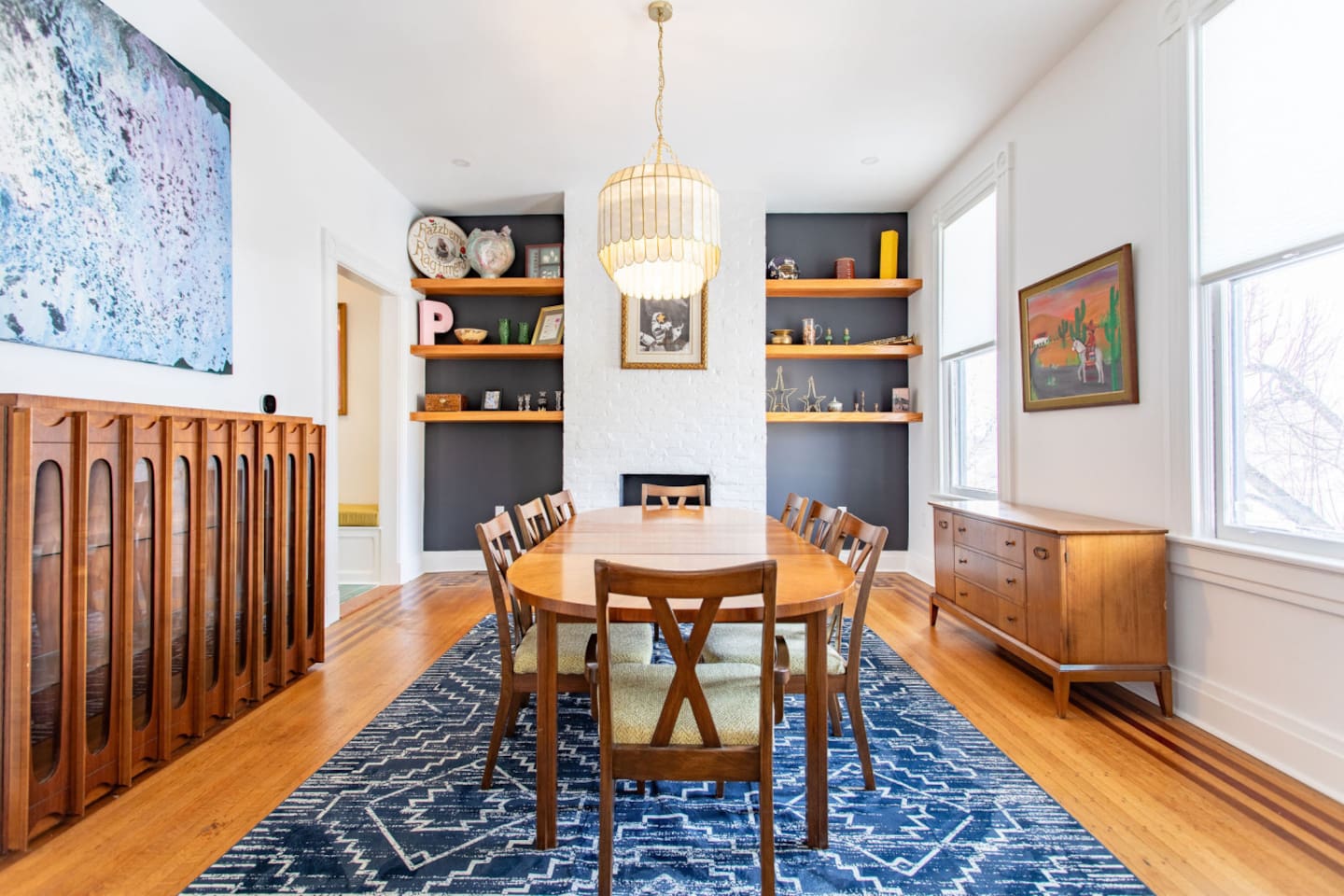 A spacious dining area featuring stylish furniture, including a large dining table and comfortable chairs, creating a welcoming and elegant space for meals and gatherings.