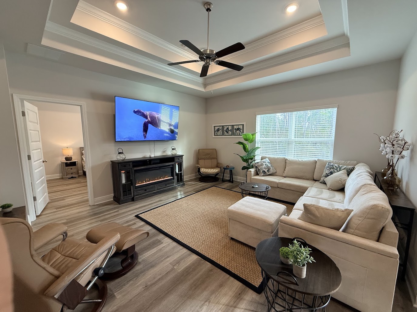 Open‑concept living room with plush seating and a large Smart TV — perfect for movie nights.