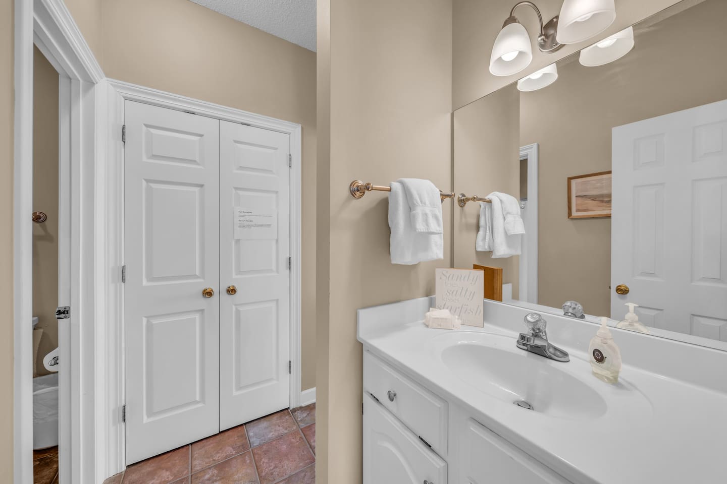 Downstairs front bathroom.  Doors to both front queen bedroom and living room