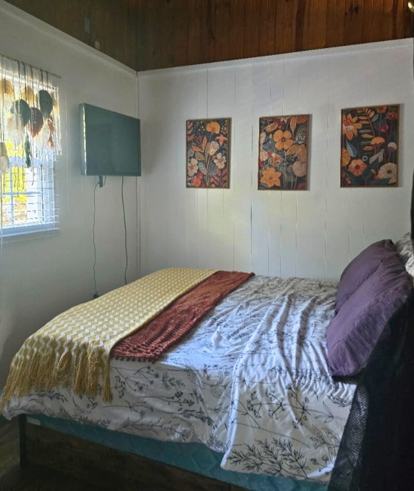 Granary‑house‑second‑bedroom‑tv‑floral‑art