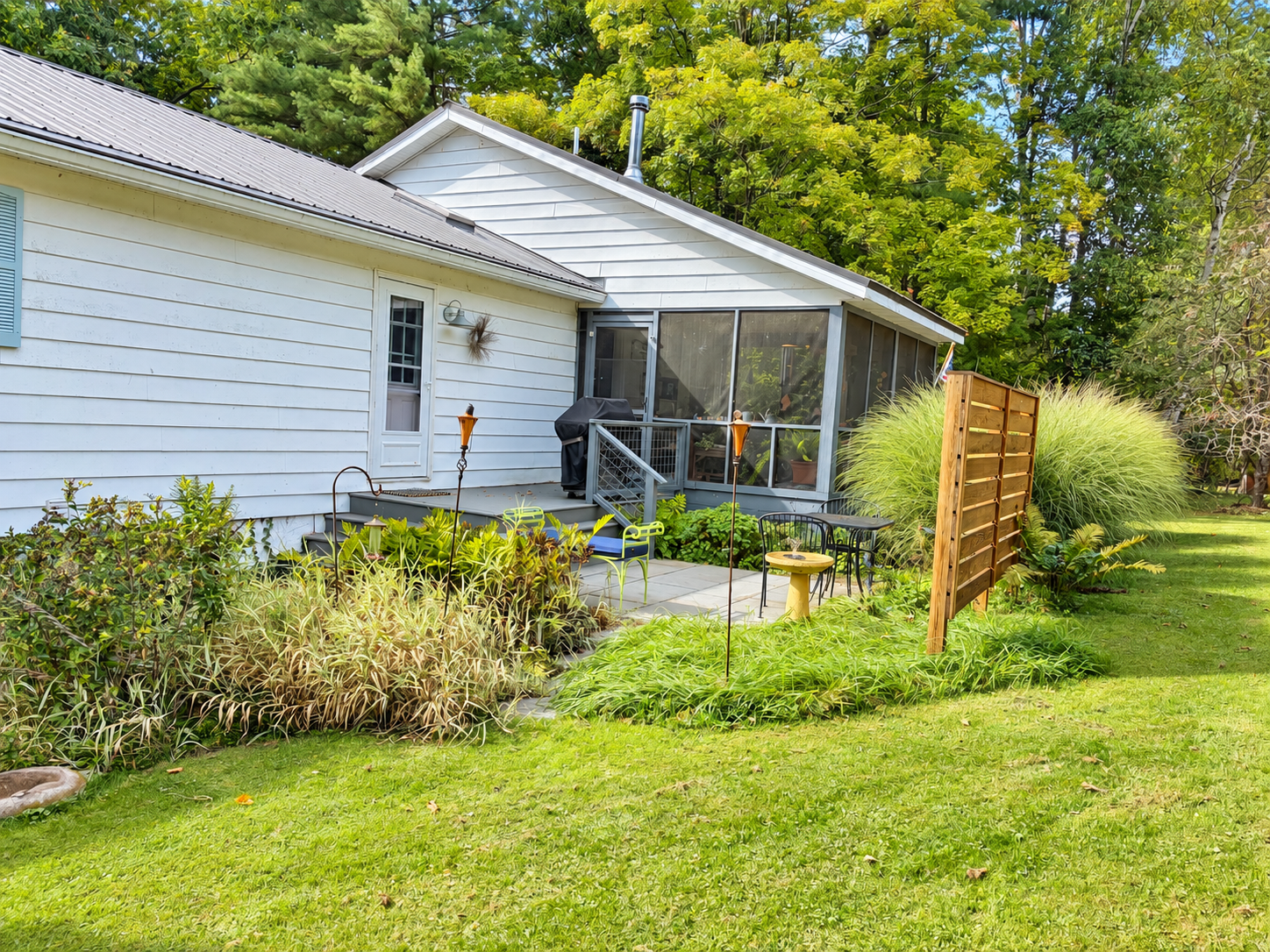 Patio beside the screened porch.