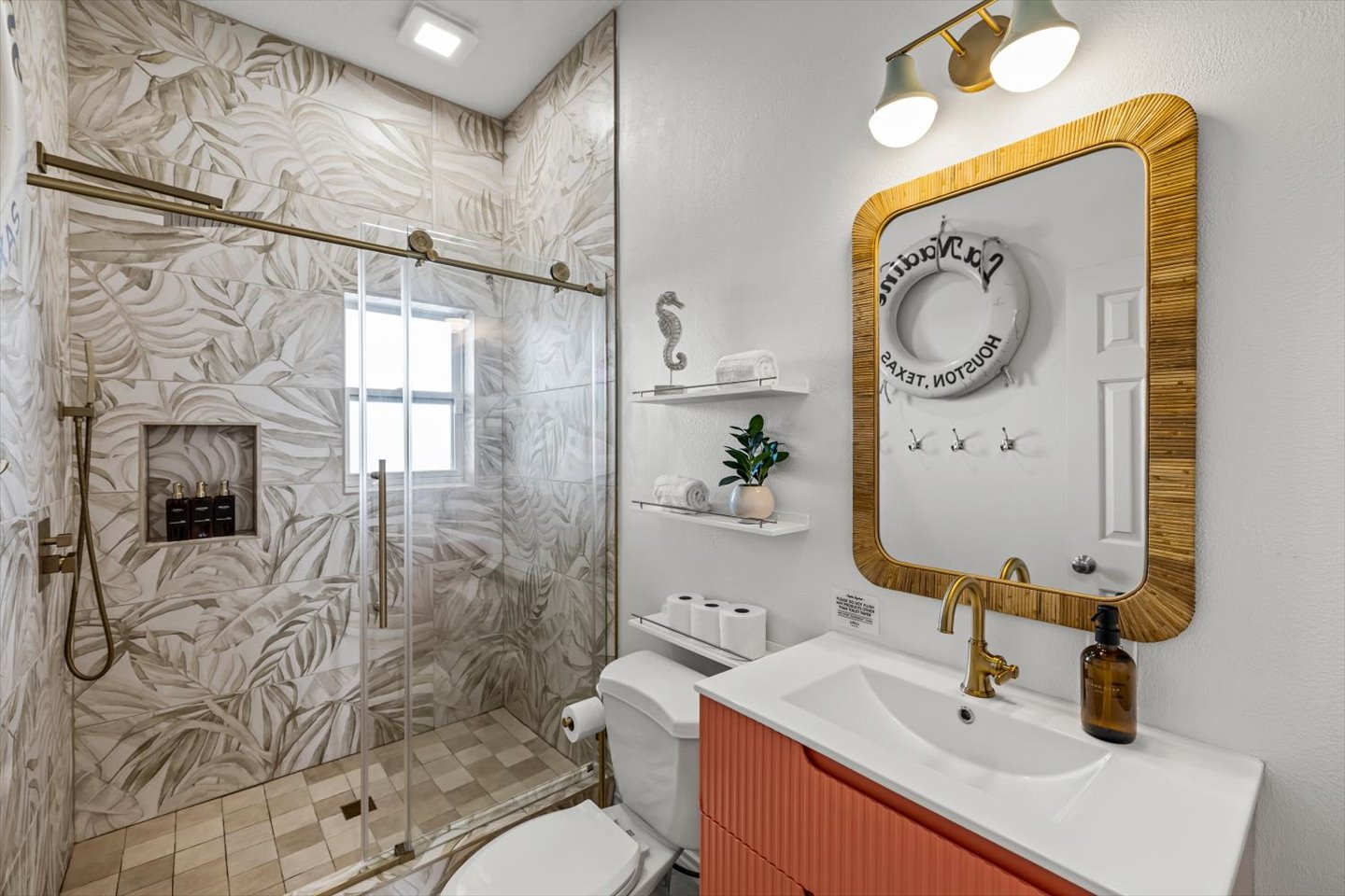 The hall bathroom has a walk in shower and plenty of hooks for towels. It is accessible for the Shorebird Bedroom and the Crab Shack as well. 