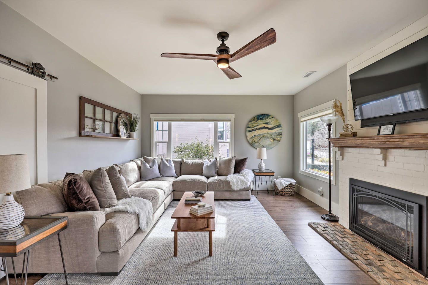 Sink into the oversized sectional and let the fireplace set the mood for a relaxing evening in.
