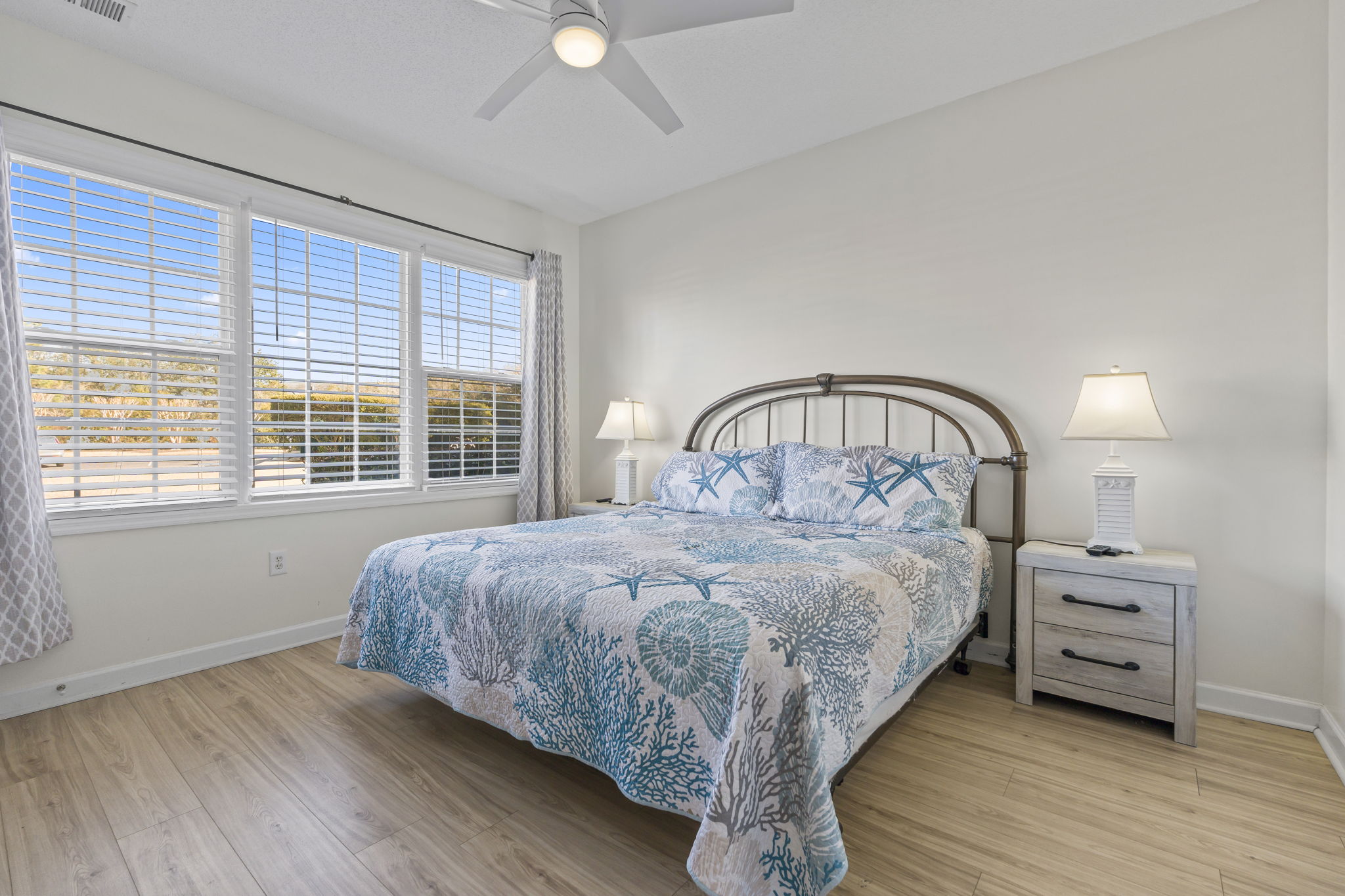 Master Bedroom with large window, king bed, ensuite bathroom