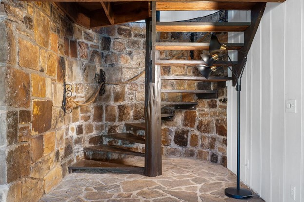 Hand-hewn wood, stone walls, and serious castle vibes