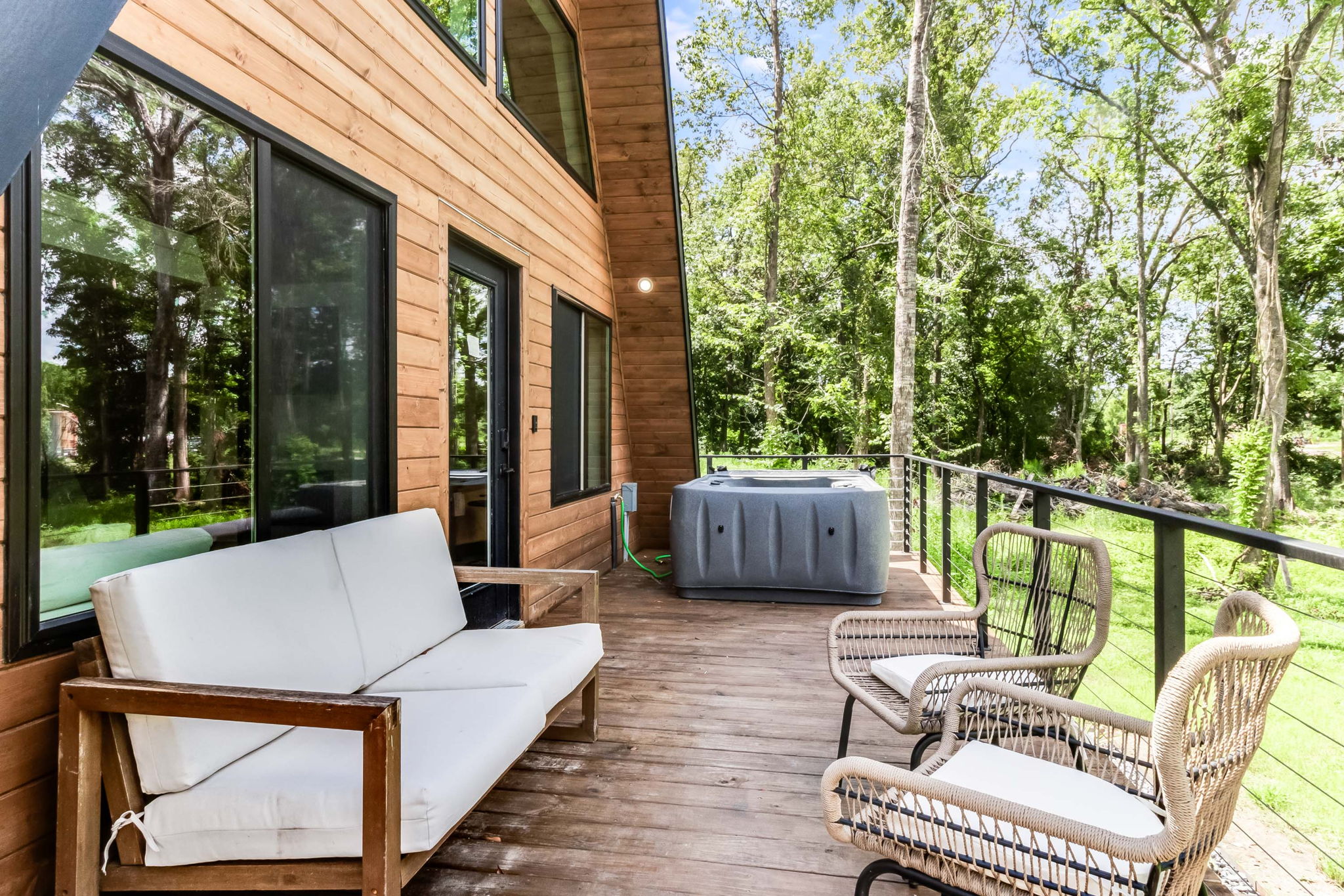 Front porch with seating and hot tub