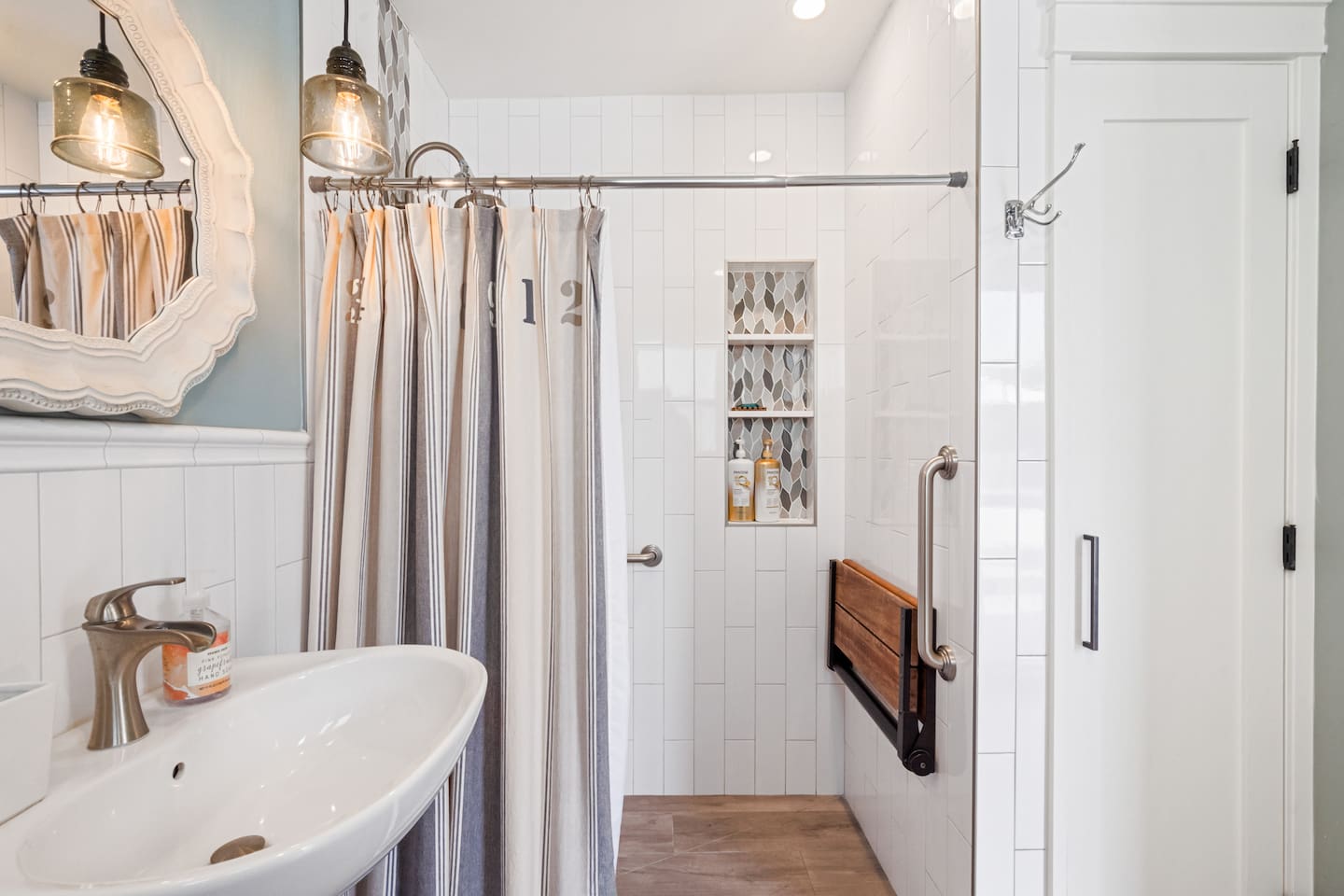 Elegant and accessible—where modern design meets thoughtful details in this inviting bathroom space.