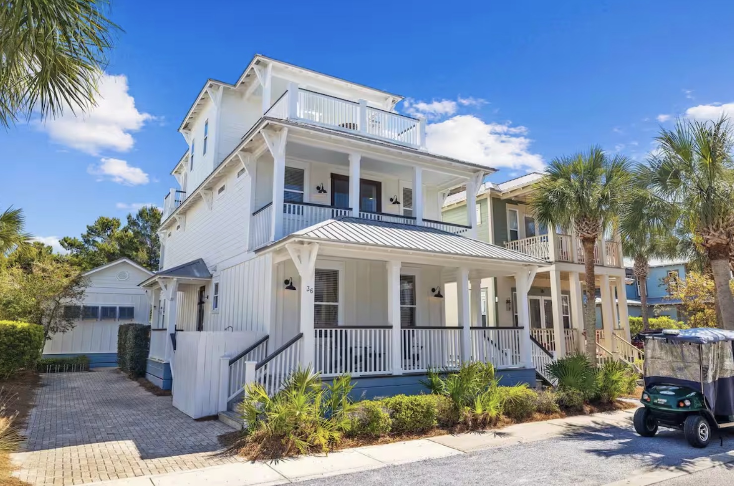 Bright 3-story home with separate carriage house, multiple porches and walkable access to the beach, pool, green space, restaurants and shops.