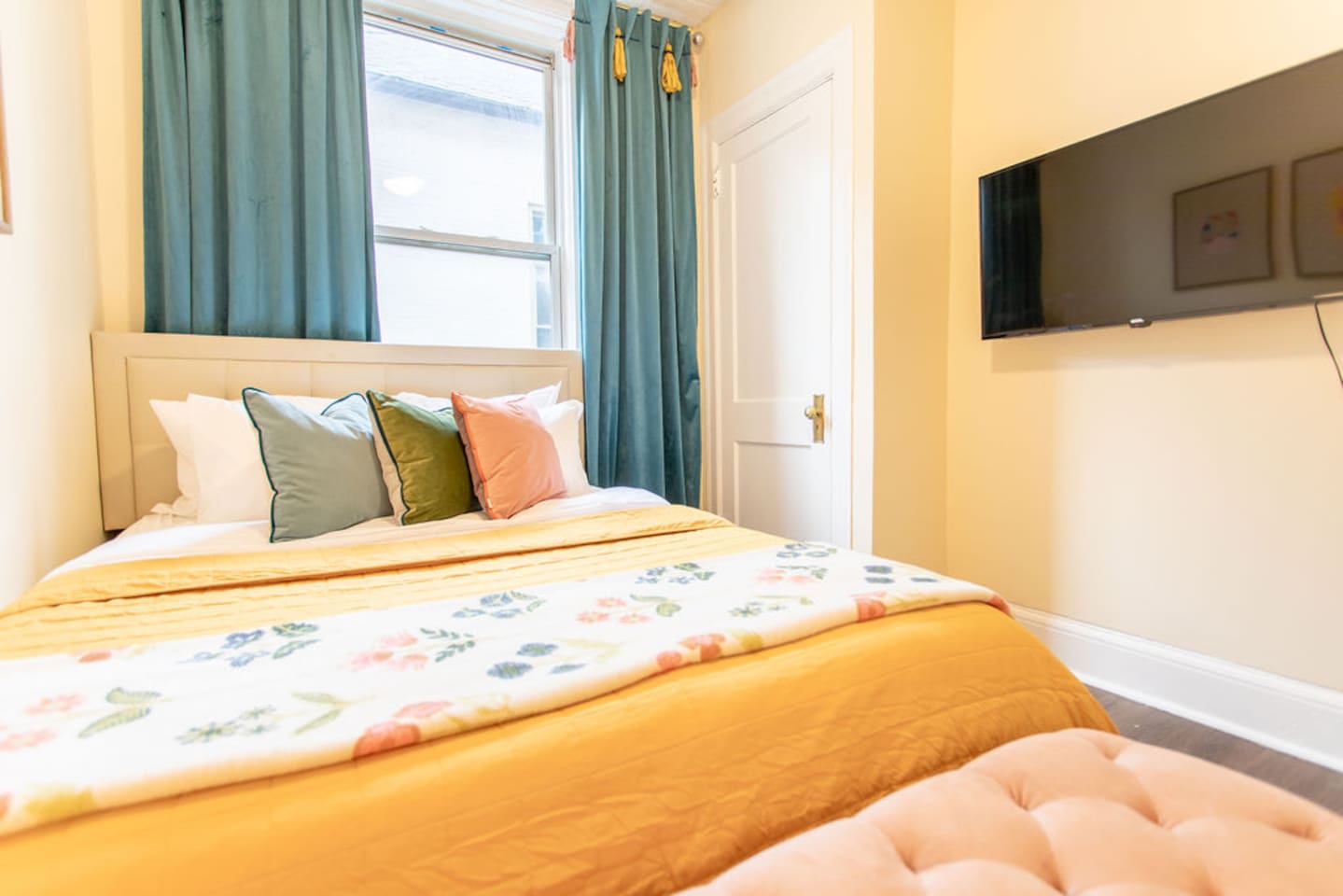 Comfortable queen-sized bedroom offering a restful retreat with ample space and natural light.