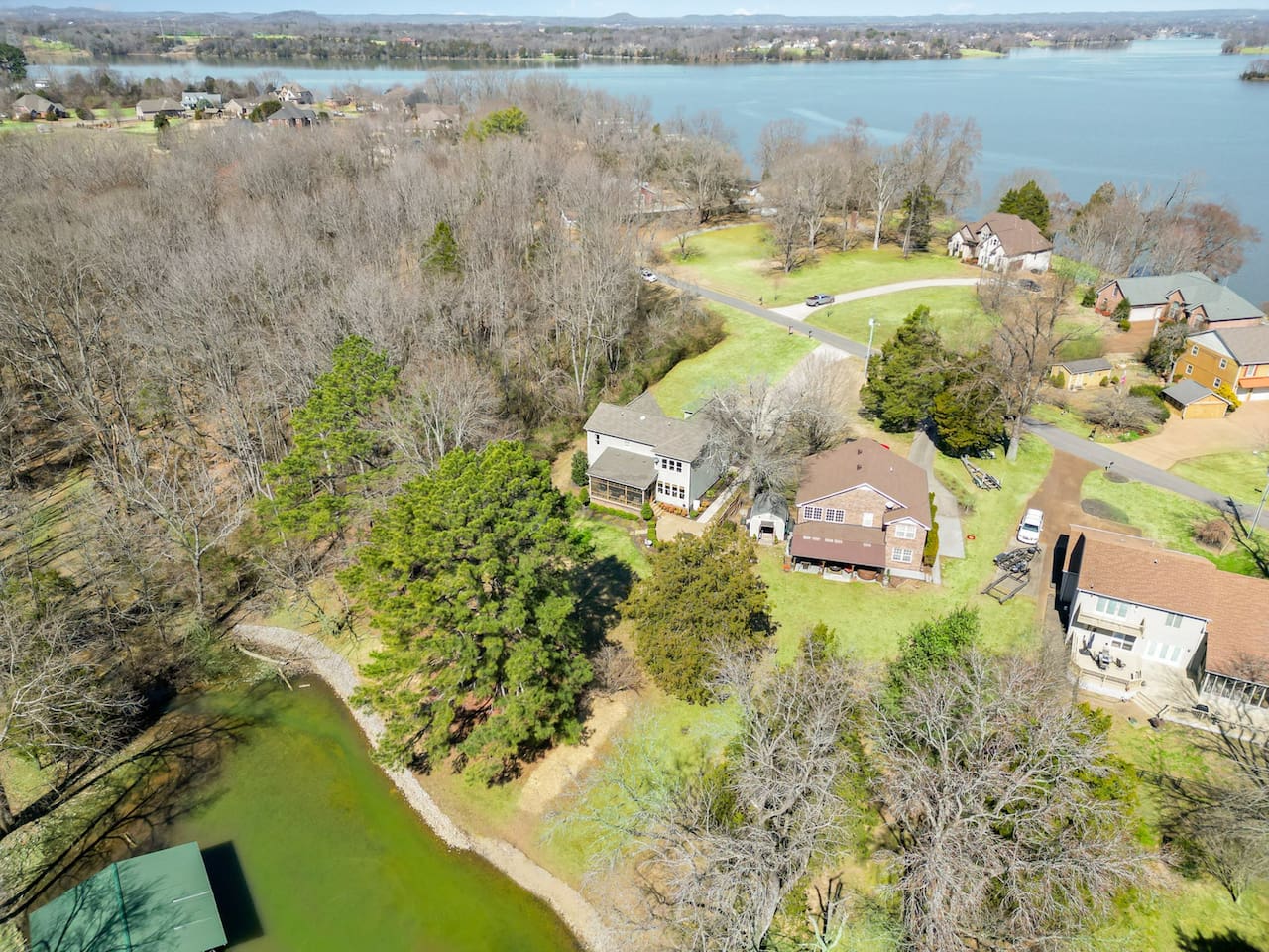 Property is on a Peninsula surrounded on three sides by the lake and cove water