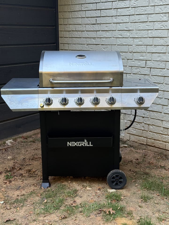 Propane grill provided with propane included, ideal for easy outdoor cooking, grilling dinners, and hosting relaxed meals.