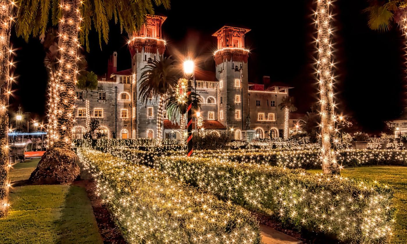 - Stunning historic building shining with beautiful sparkling holiday lights - Elegant pathways lined with shimmering trees create breathtaking scenes - Enchanting nighttime setting perfect for strolls and festive exploration