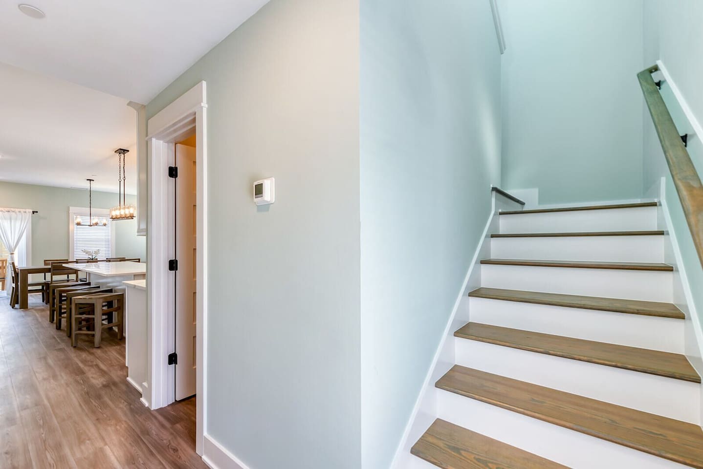 Welcoming interior entryway leading into the home’s upper living spaces.