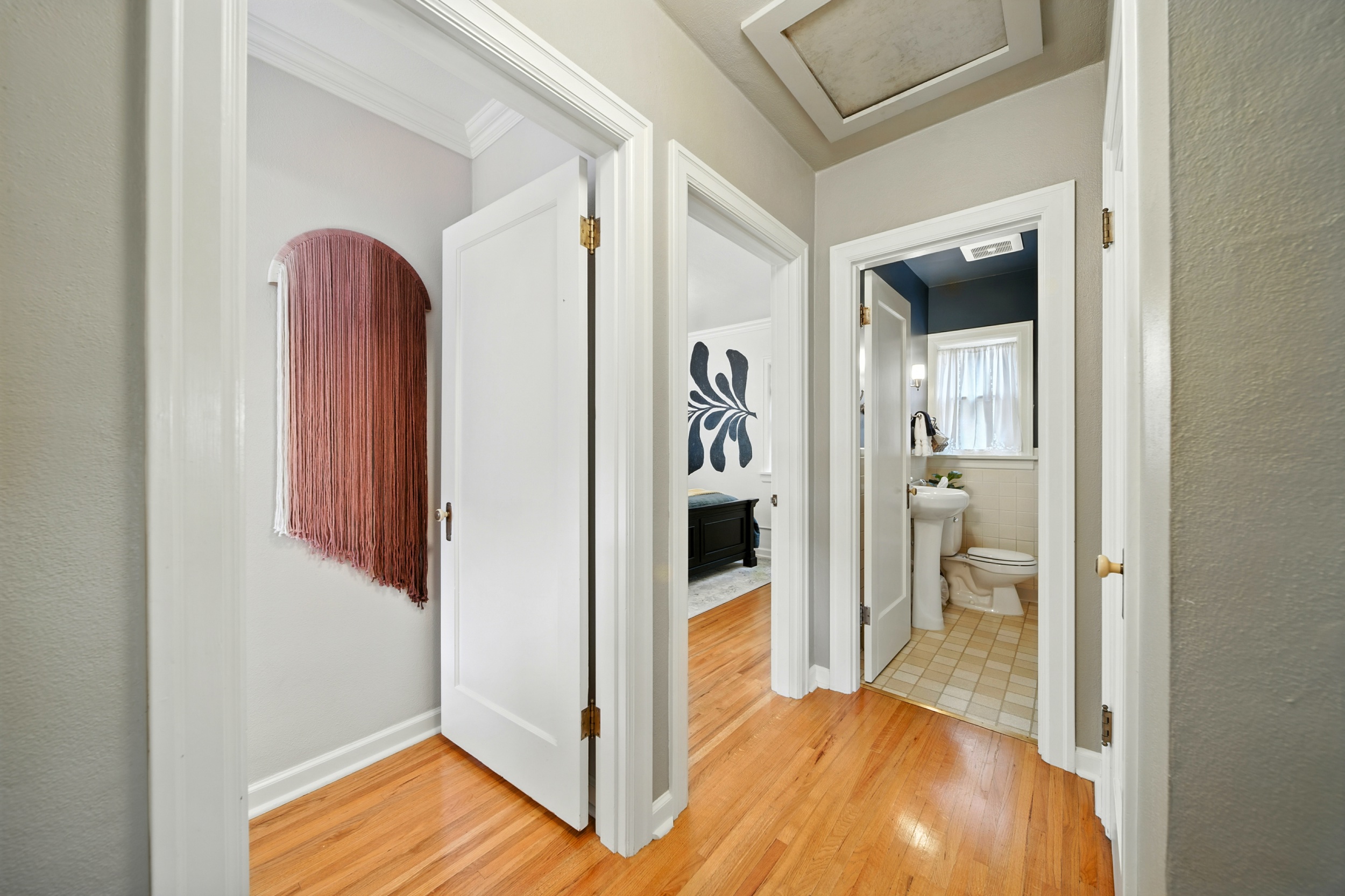 Hallway between main floor bedrooms and main floor bathroom