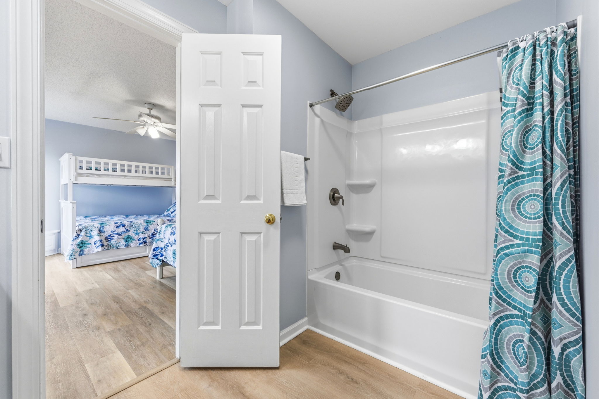 Perfect for families, this Jack and Jill bath includes a shower/tub combo. Little ones’ favorite spot for post-beach bubble time