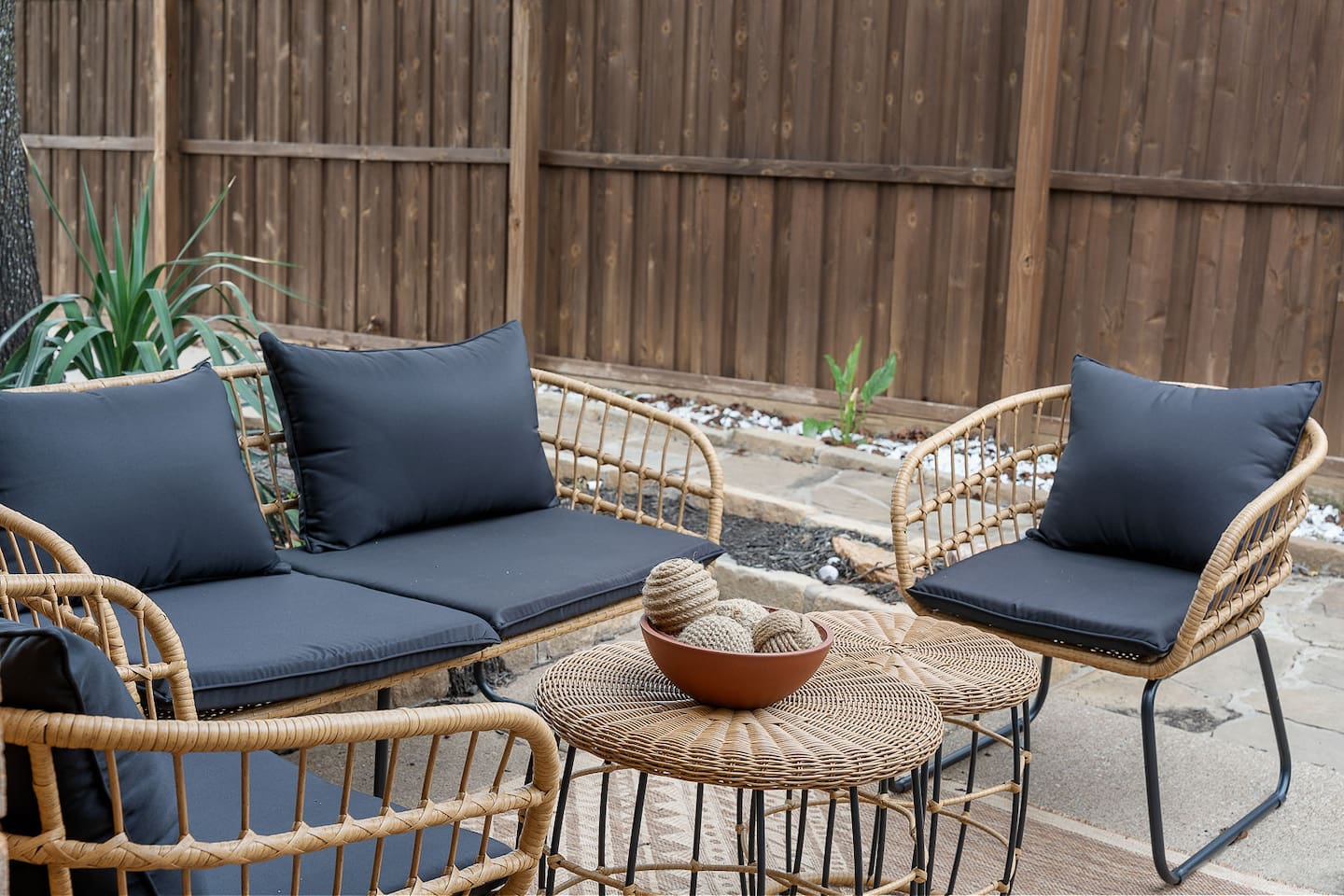 Relax in this cozy outdoor seating area, perfect for casual conversations and enjoying the fresh air. The setup provides a welcoming retreat.