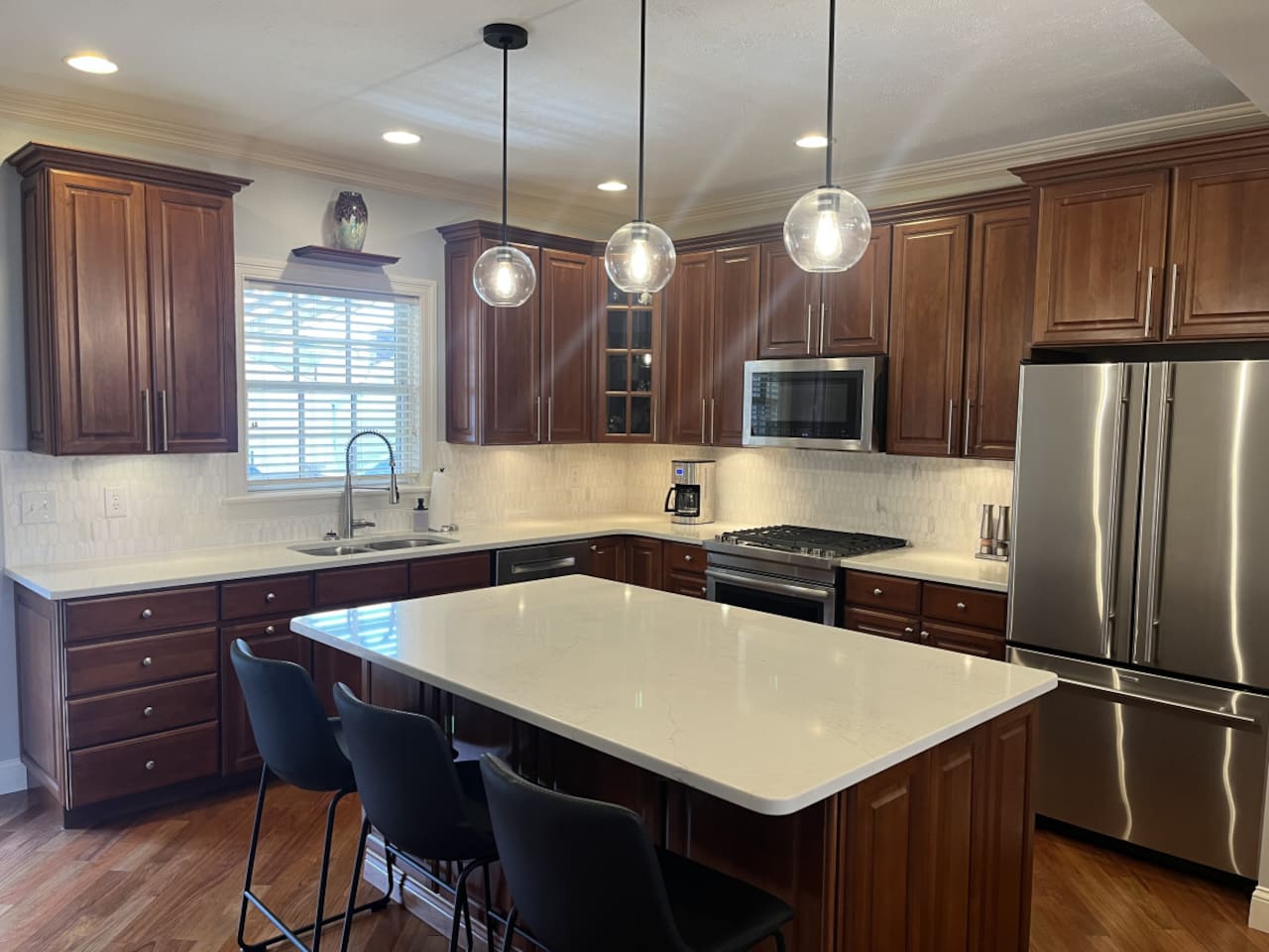 Well-appointed kitchen with a spacious countertop, providing plenty of room for meal prep, cooking, and entertaining.