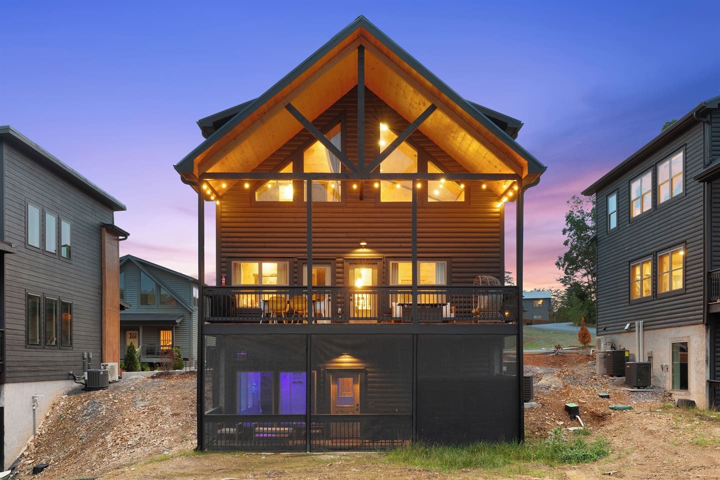 The back side of the cabin has two outdoor seating/ socializing areas
