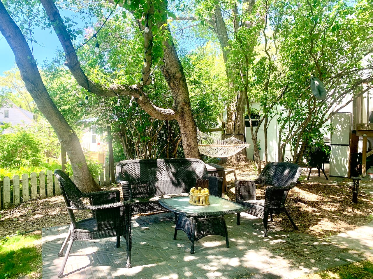 Patio conversation set under the large elm trees. 