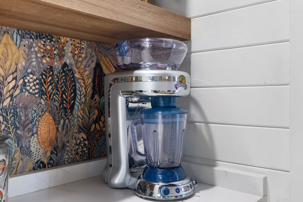 Kitchen Delight: Modern blender for crafting delicious smoothies in a vibrant, nature-inspired space!