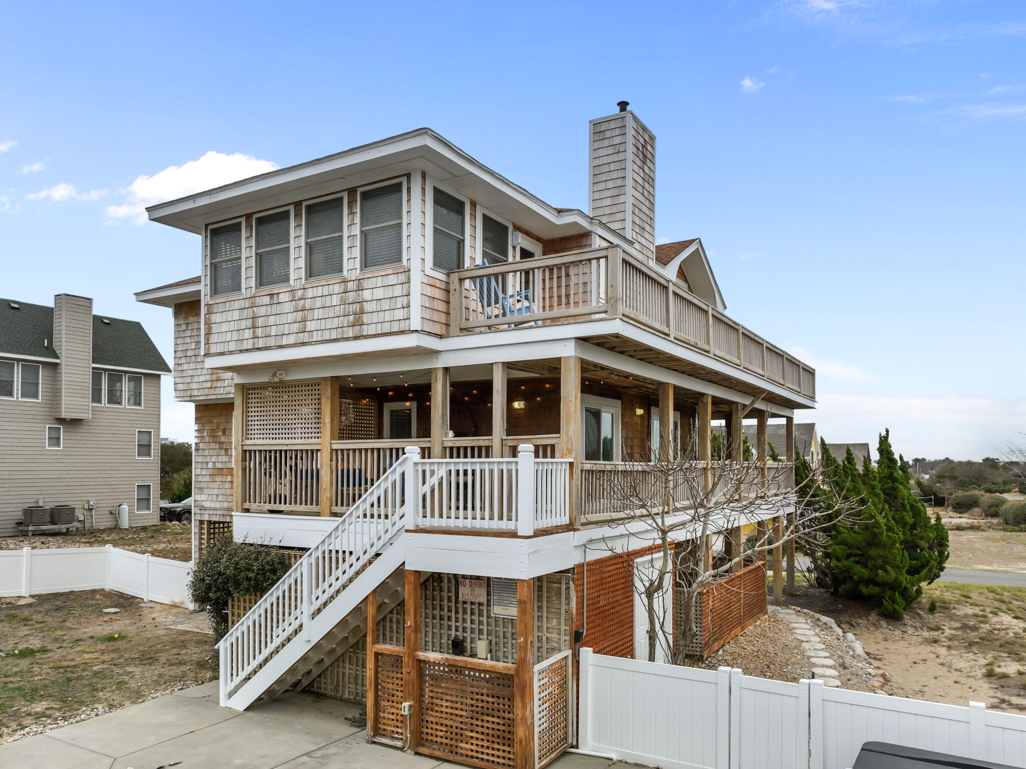Welcome to Bay Watching—three levels of decks and classic coastal style.