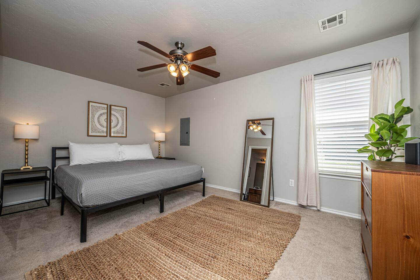 Comfort meets elegance in the master bedroom’s king-size haven.