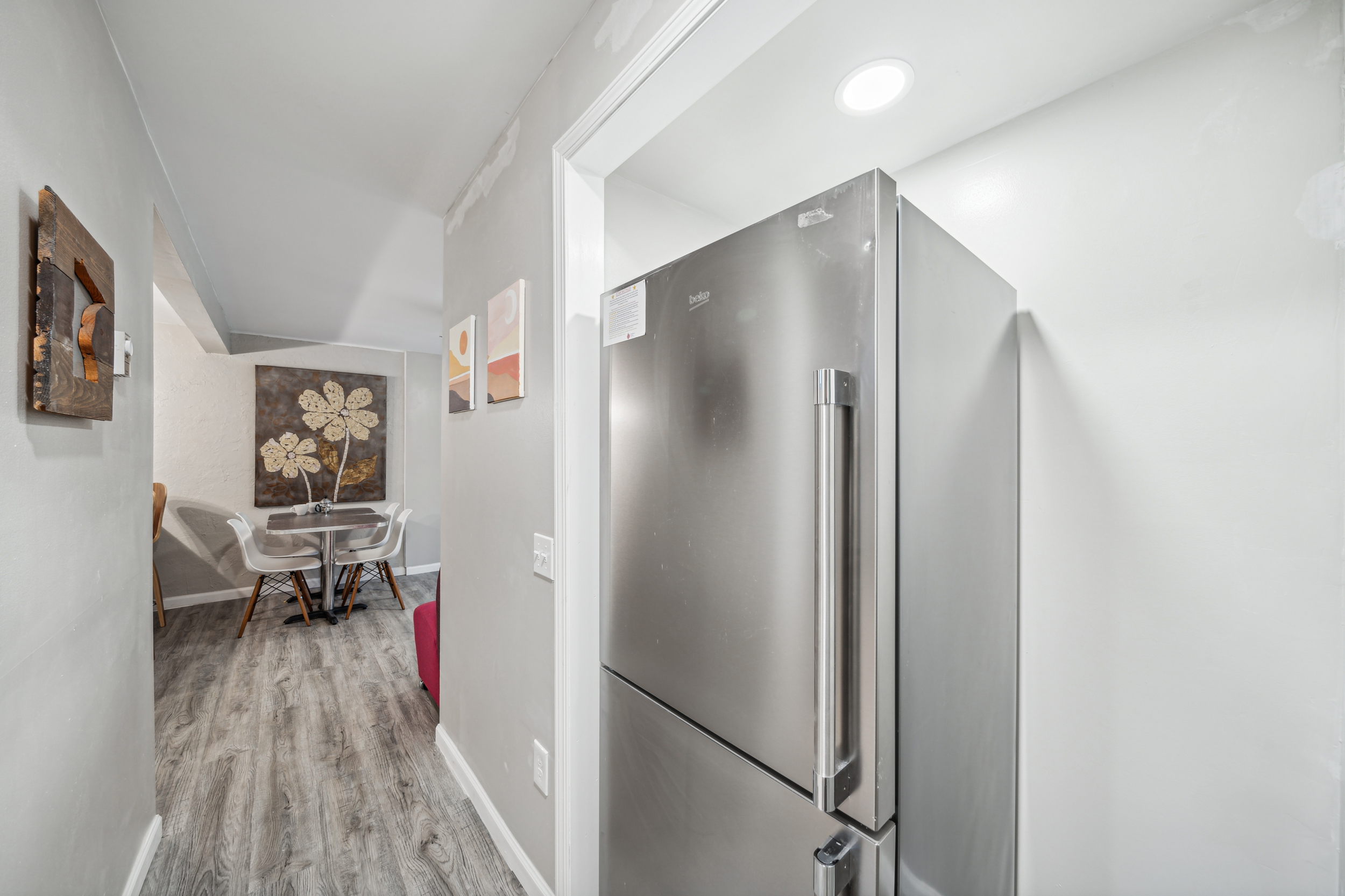 The hallway to the bedrooms in the lower apartment has a standard refrigerator. The freezer is on the bottom, 100% below 54" and the fresh food storage drawers and first 2 shelves are below 54