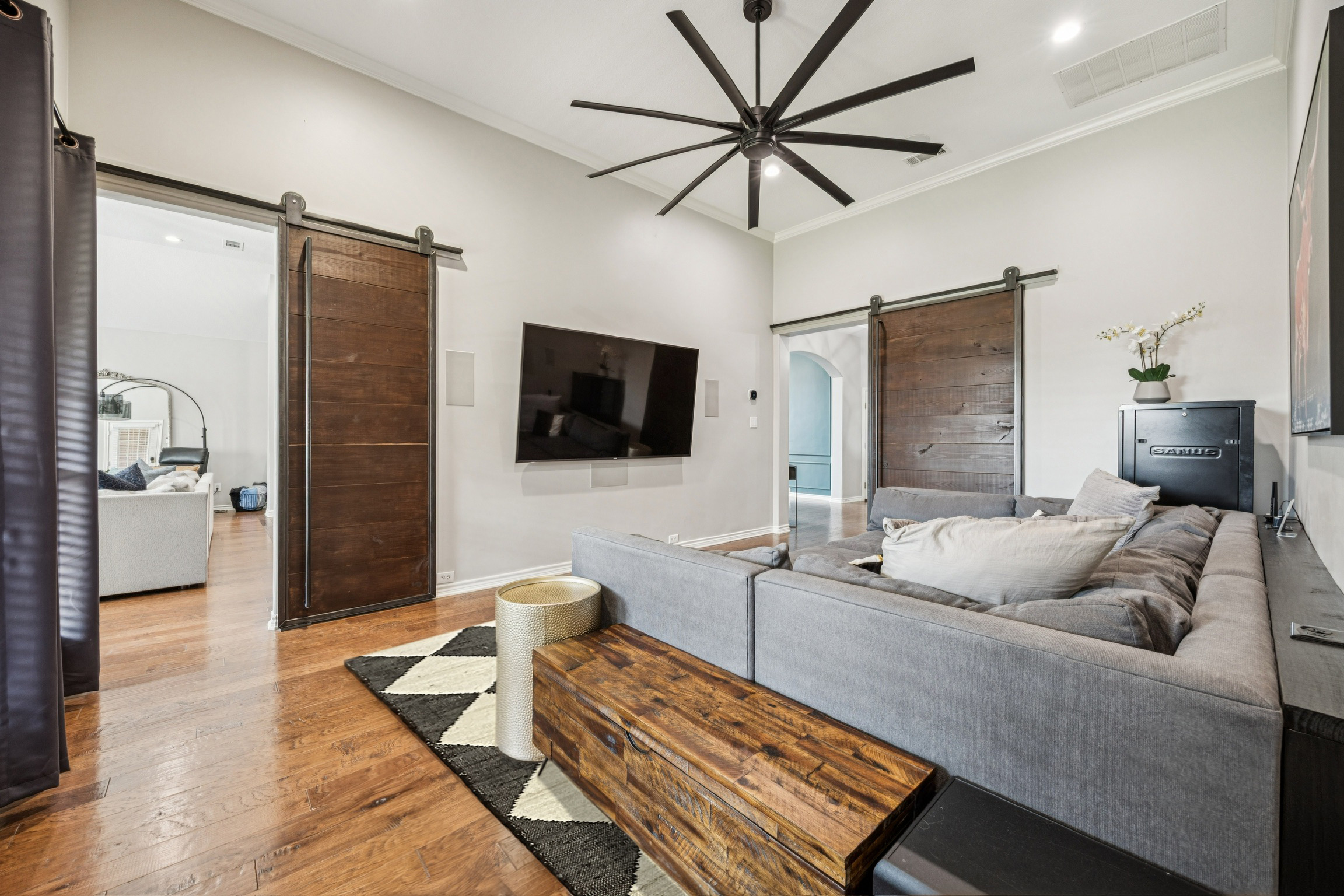 Barn doors create privacy for the ultimate cinematic experience.