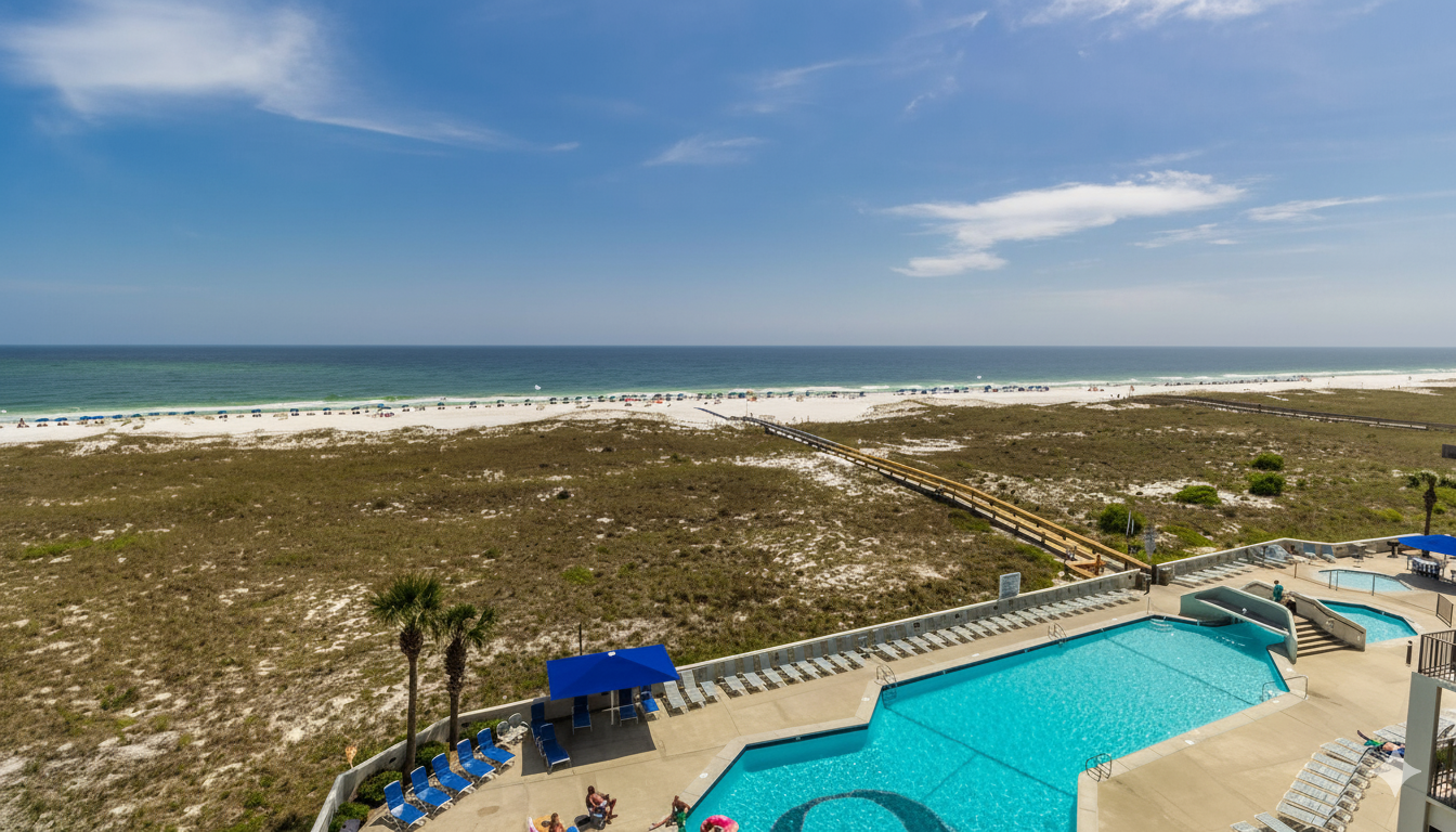 Your resort playground, right below! Admire the vibrant energy of the pool area, the convenient boardwalk to the beach, and the tranquil beauty of the ocean, all from your elevated private bal