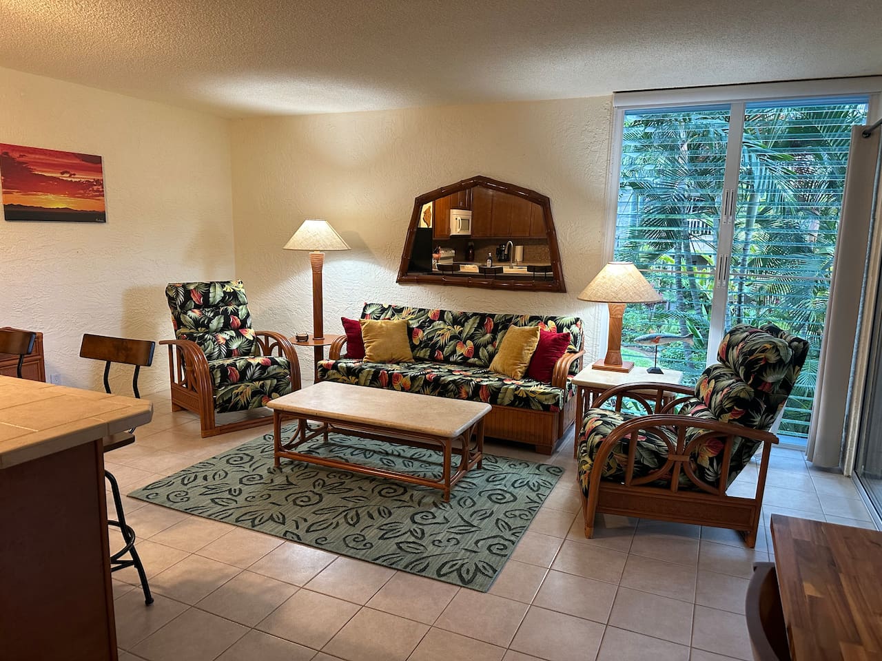 Comfortable island-style living room with tropical furnishings and plenty of space to unwind after a day of adventure.