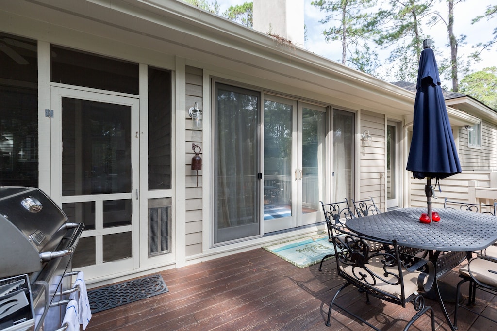 Screened porch off deck; Deck features a grill and patio dining are