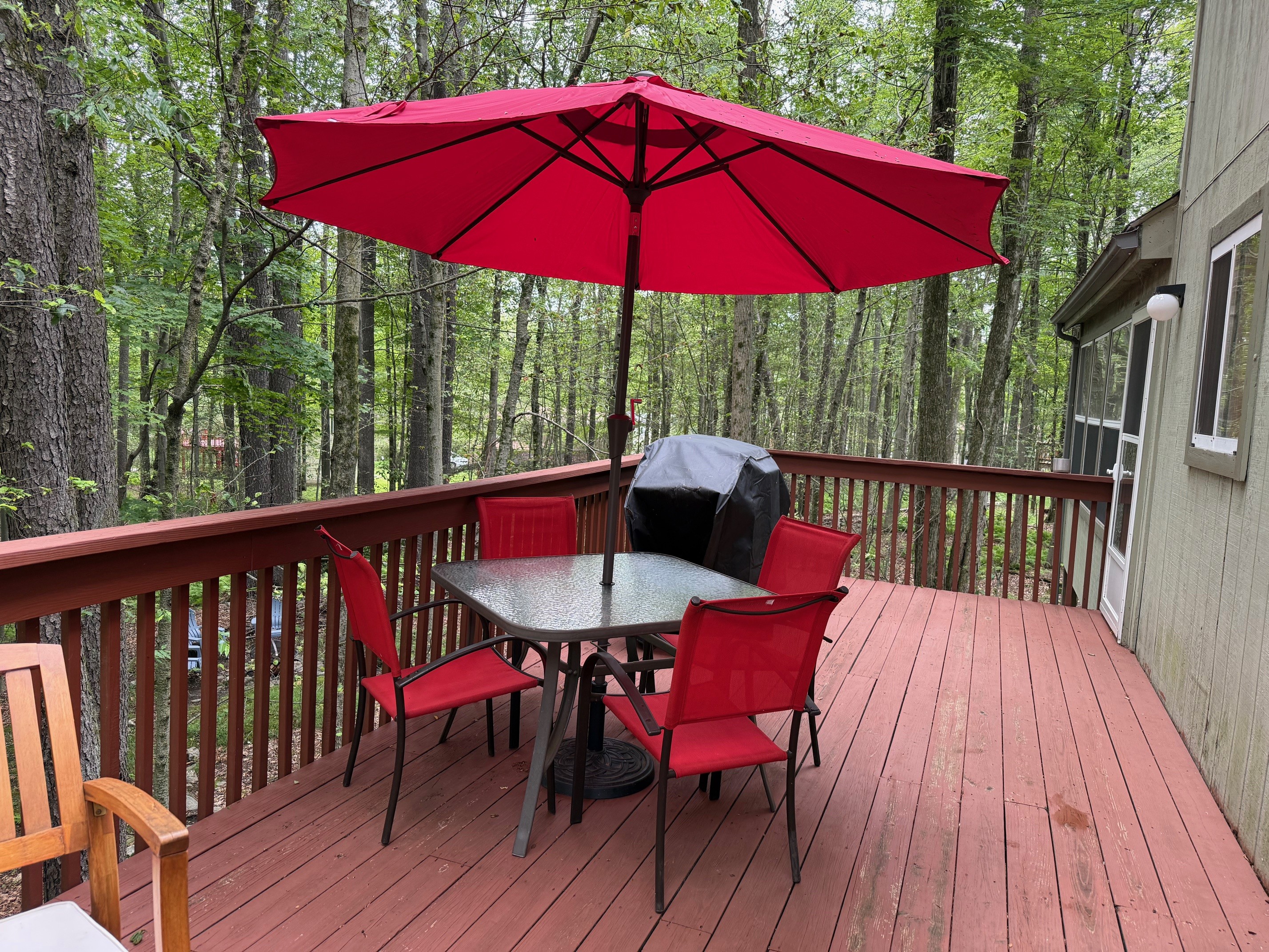 Tables, seating and BBQ on deck