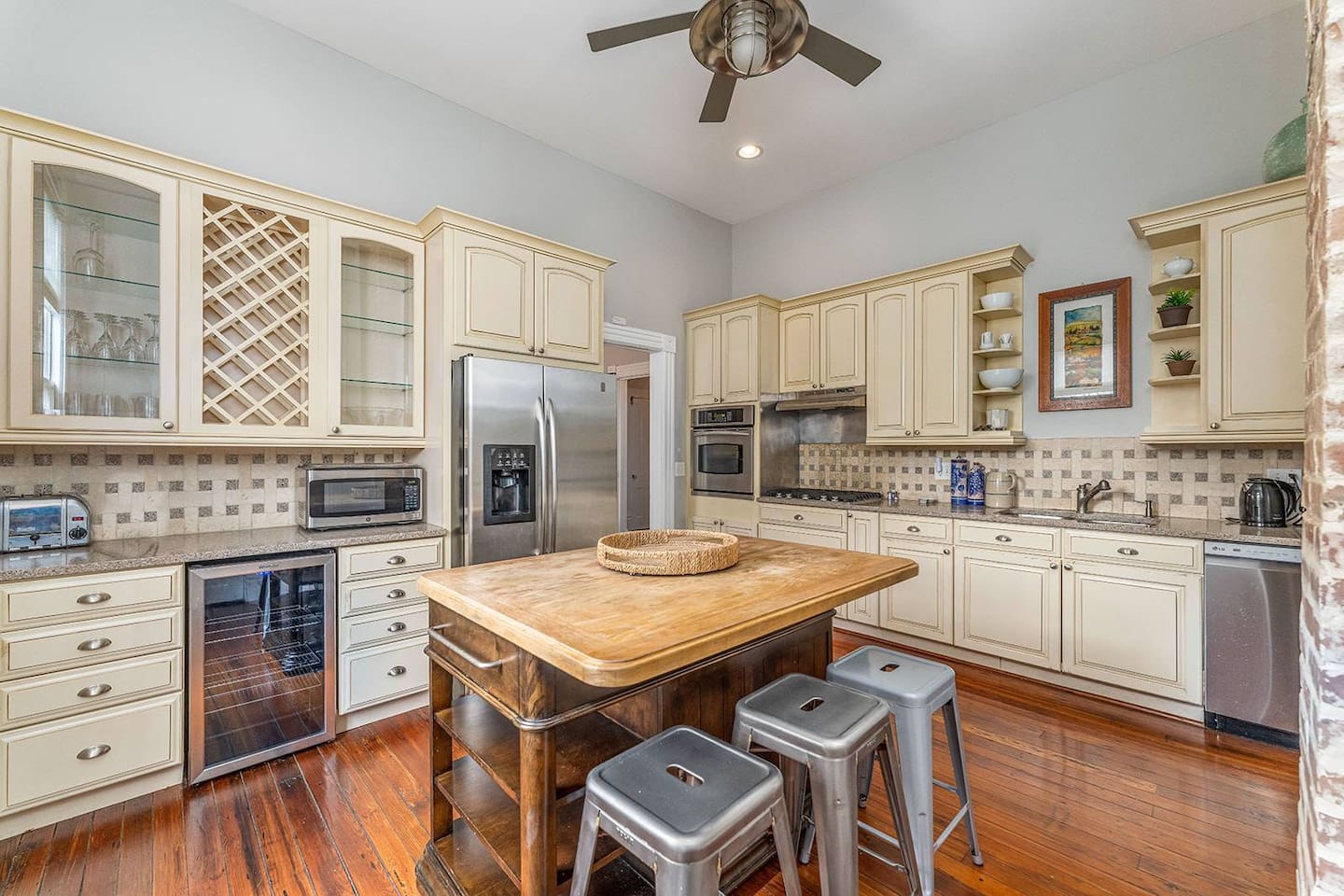 Bright, open kitchen with a new refrigerator (not pictured), wine fridge, and all of the appliances you'd expect in a high-end rental.  Gas stovetop and ample counter space to let the cook in your crew to work his/her magic.