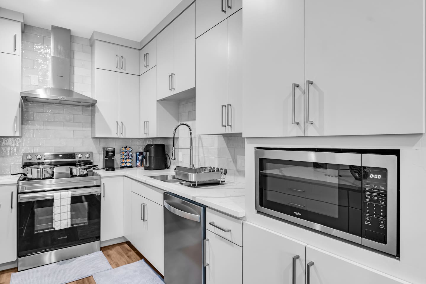Luxury kitchen with premium finishes, oversized island with bar seating, and a seamless flow into the open living space—perfect for entertaining in style.