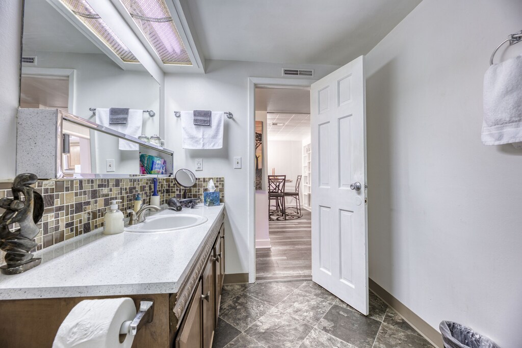 Spacious bathroom with walk-in stall shower with great water pressure.