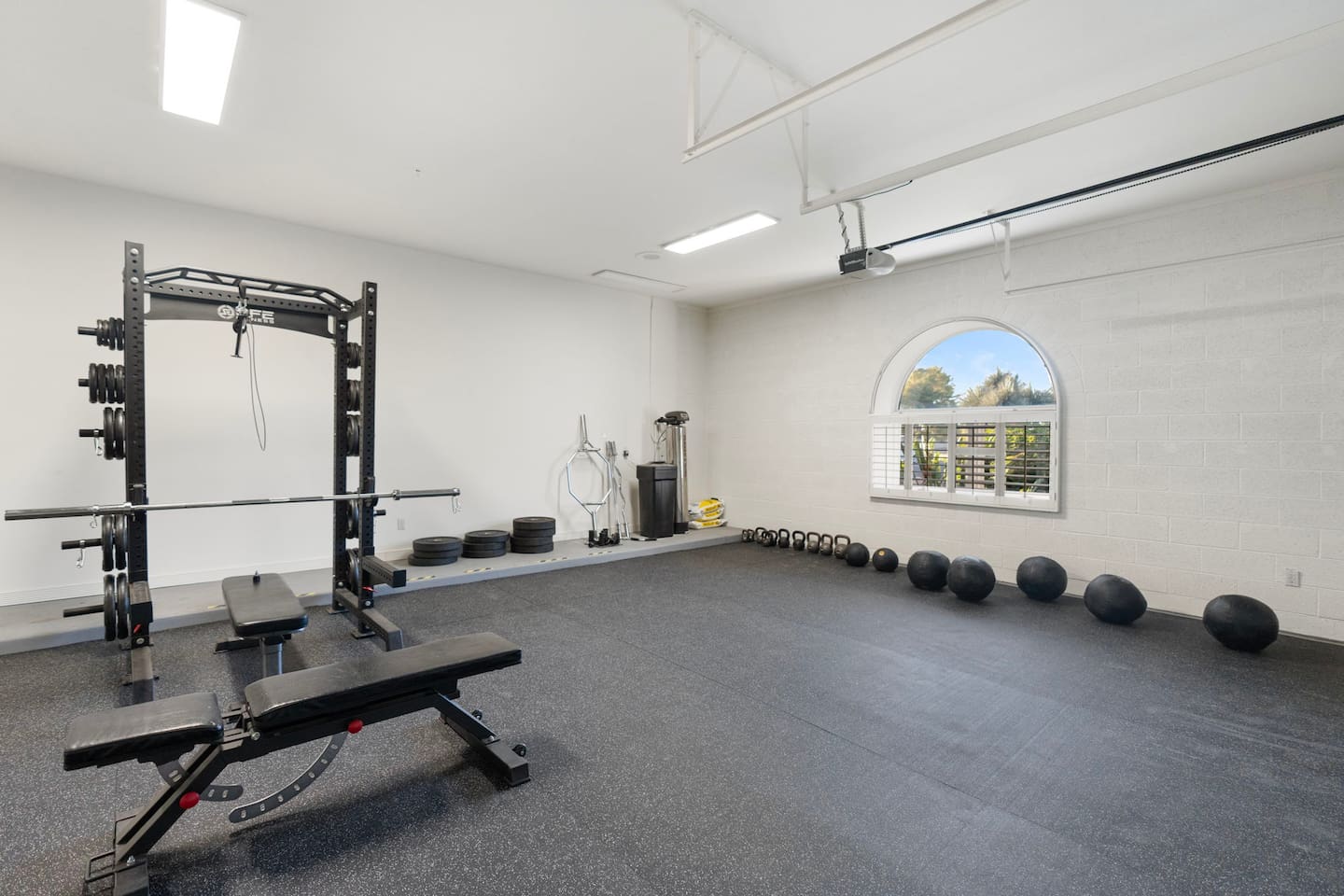 Stay energized with plenty of natural light and a scenic view while working out in this spacious fitness room.

