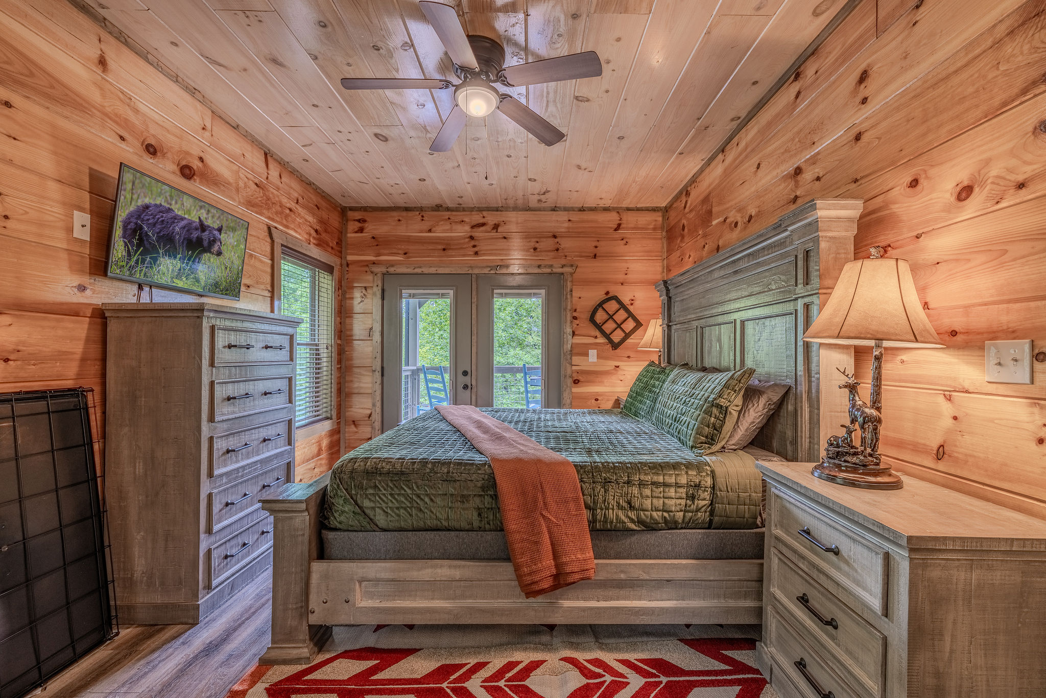 The Cartographer’s Suite is the main-level king bedroom, inspired by maps, travel, and the spirit of adventure.