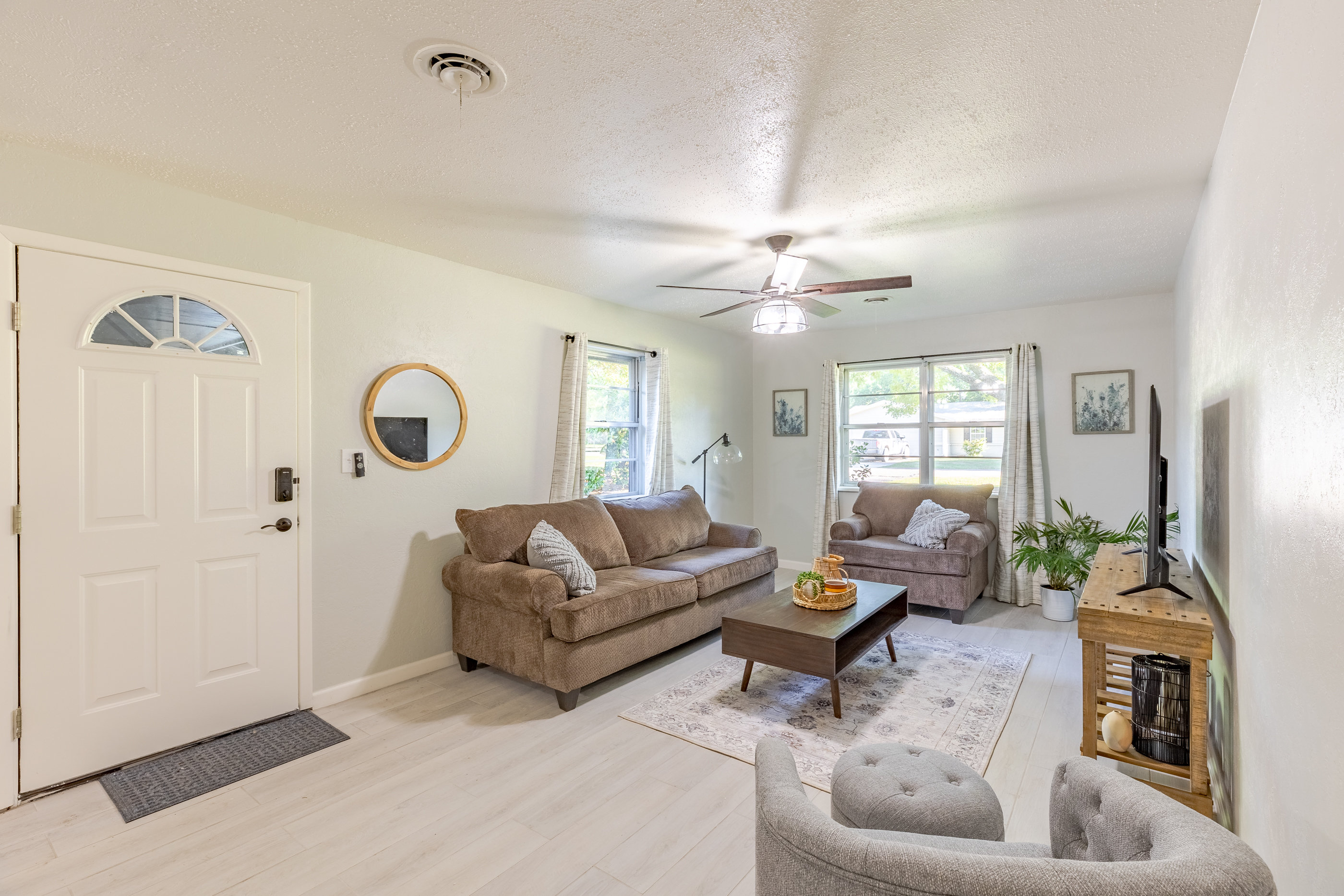 Inviting living room with smart TV and plenty of comfort.