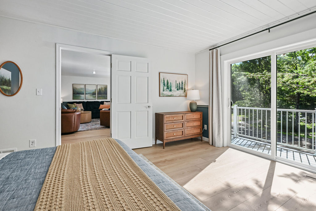 Bedroom 4 - Door to family room and balcony facing forest and driveway