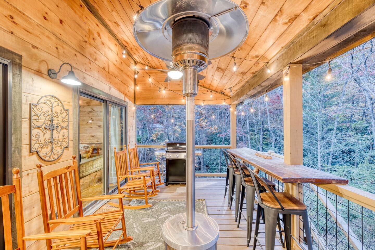 Front porch retreat: Seating, dining, and BBQ grill await