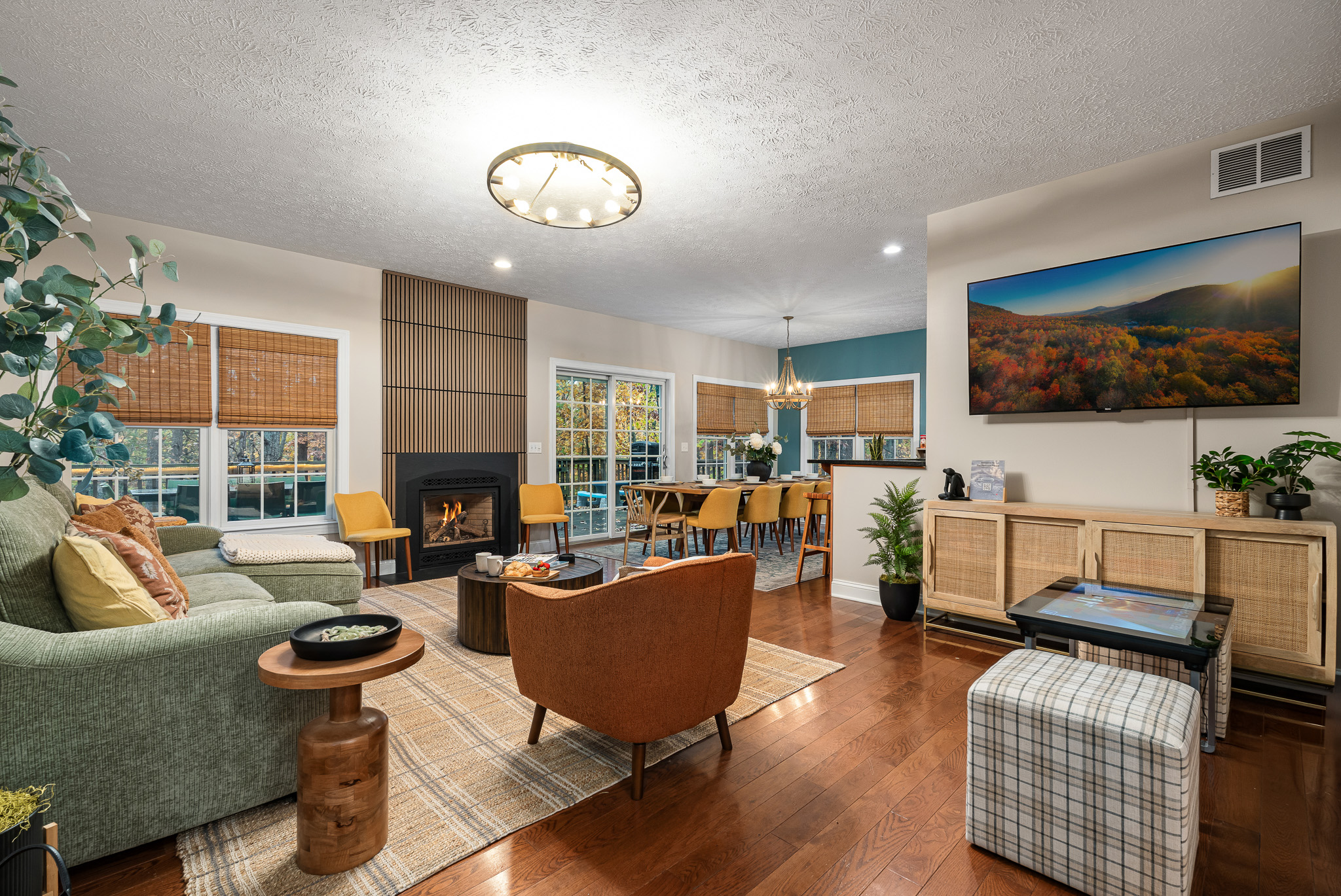 Bright, open living space with a cozy fireplace and plenty of room for everyone to gather. Whether it’s game night or wine night, this is the heart of the home.