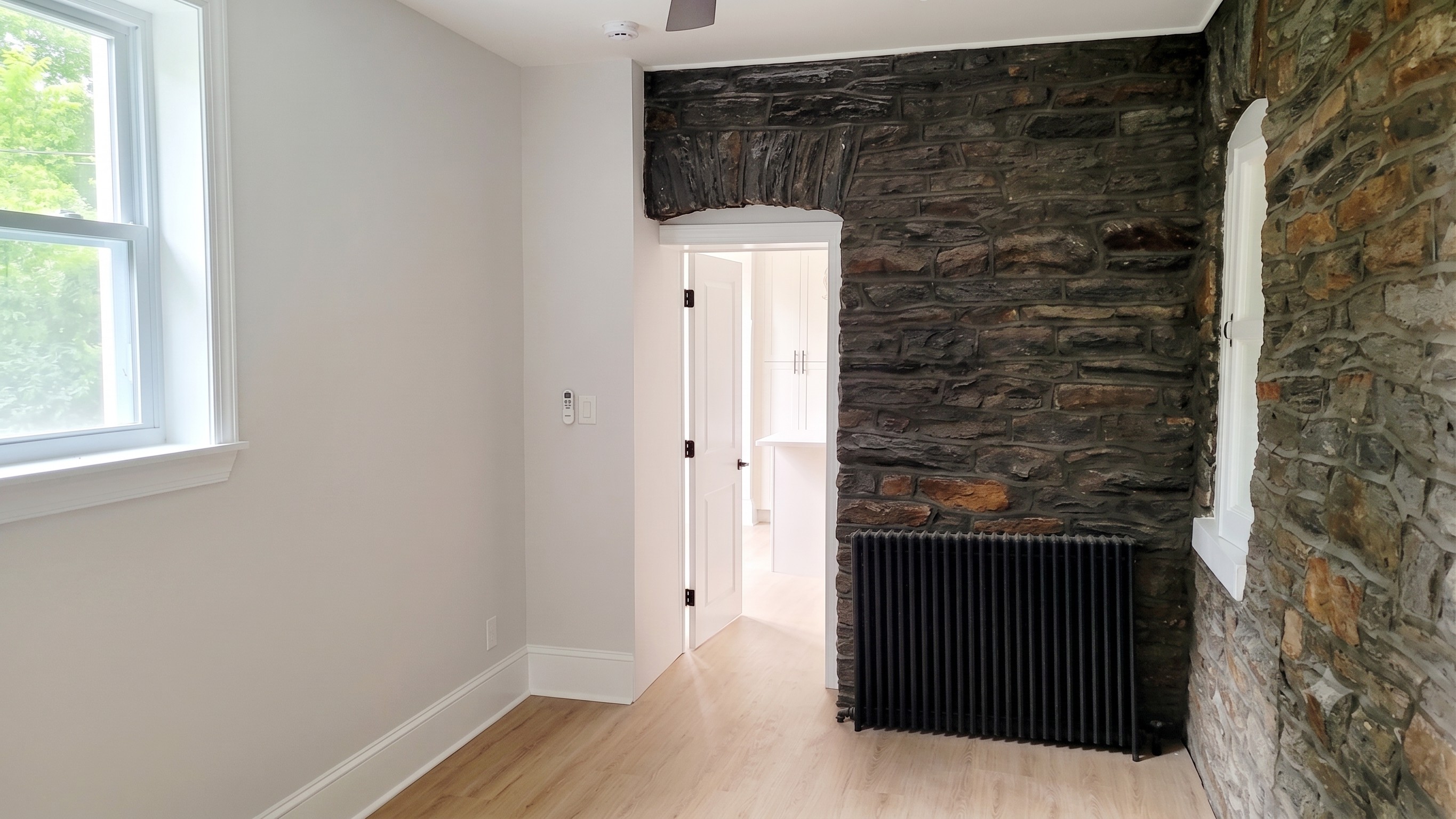 Exposed stone combined with updated finishes contribute to a cozy vibe.