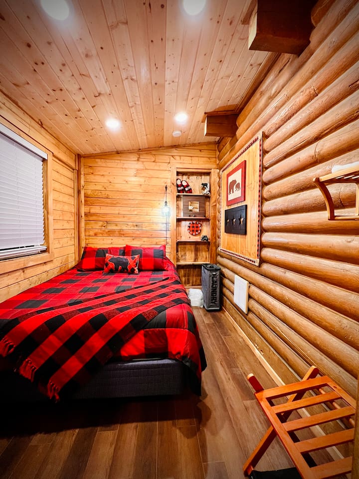 Hibernatin' Haven is located on the main floor and accommodates 2 with a queen size bed.