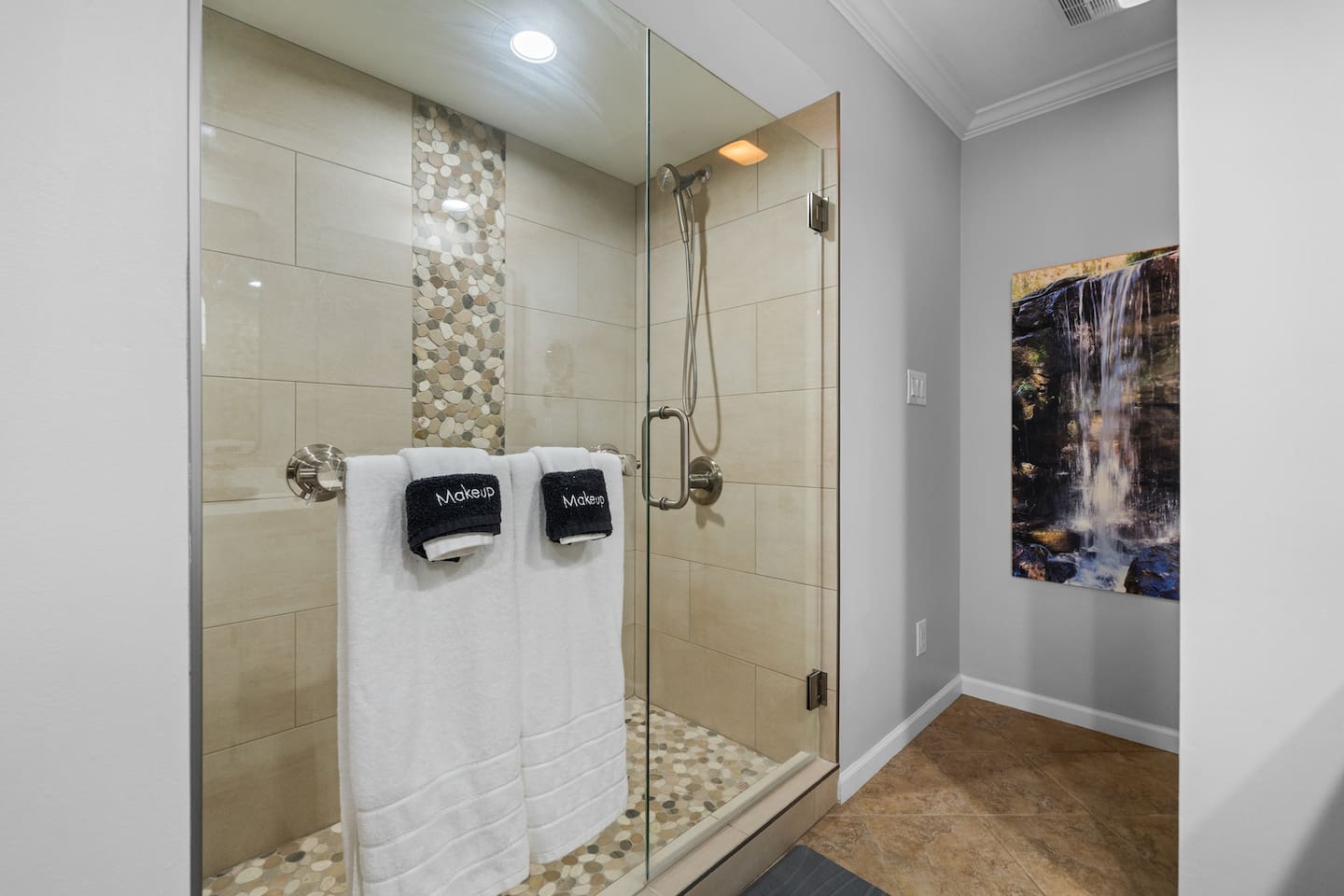 The Stone Touches infuse a little Nature into this Custom Tile Shower.