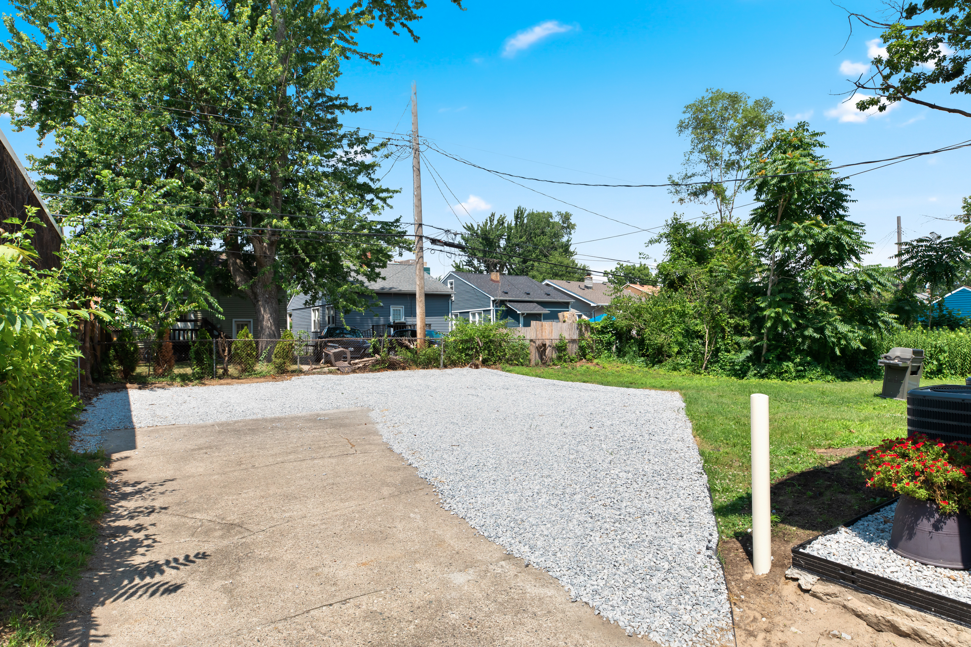 Private gravel parking area located behind the home - this is shared with the lower unit - parking available for one vehicle