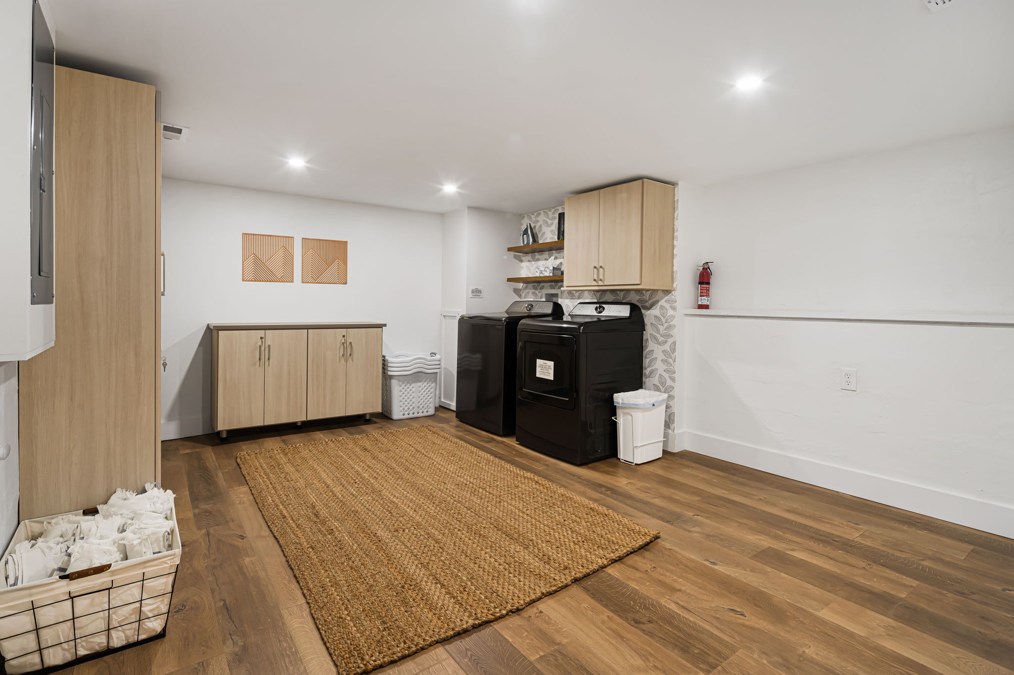 The laundry room has a full size washer and dryer and the convenience of an ironing board and iron.