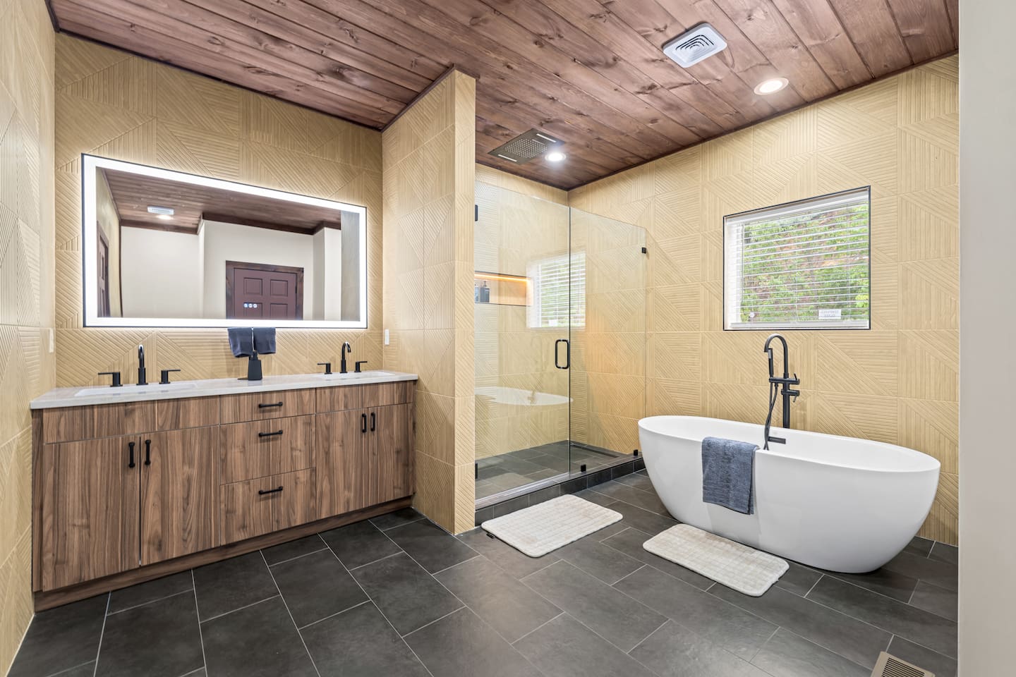 master luxury bathroom with soaking tub, waterfall shower head and 6 wall mounted water jets and water wand 