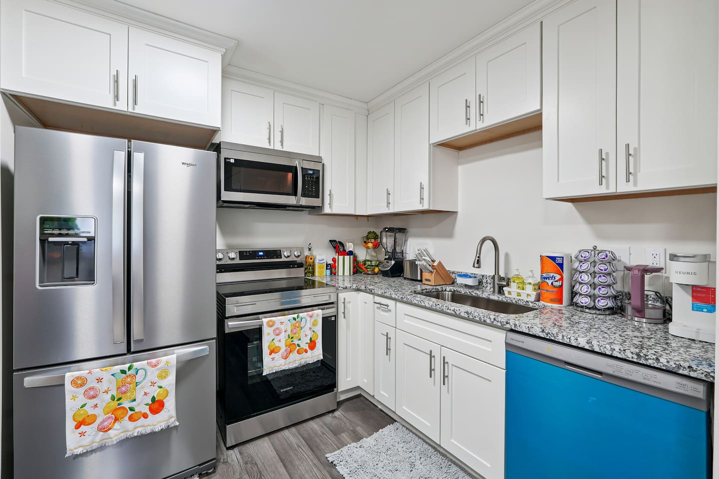 Full kitchen thoughtfully stocked with everything you may need including cookware, utensils, dishes, and essential appliances perfect for preparing meals and enjoying a true home-away-from-home experience.