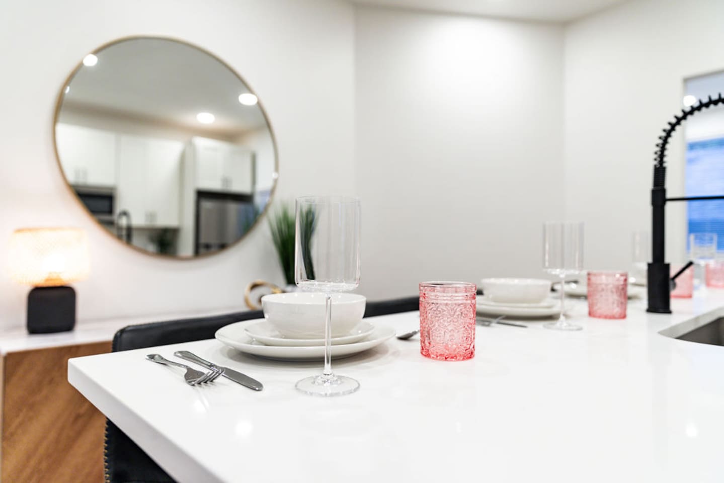 Countertop kitchen table set with neatly arranged plates, ready for your next meal.