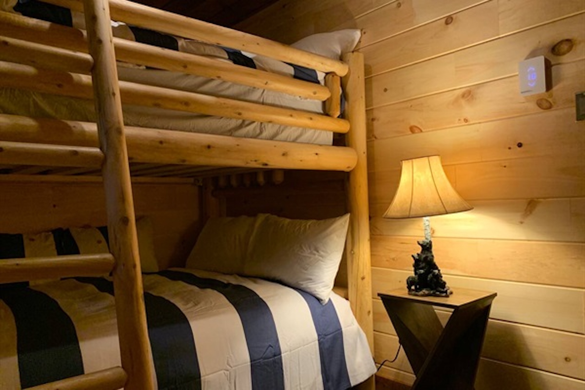 Bunk beds with bedside lighting and comfortable bedding